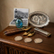 Collectables scene of mixed vintage items on a dark wood sideboard