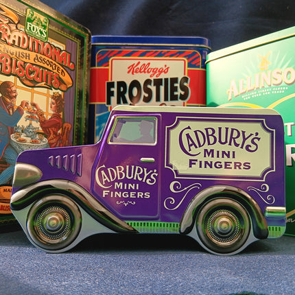 A collection of vintage tins on a shelf