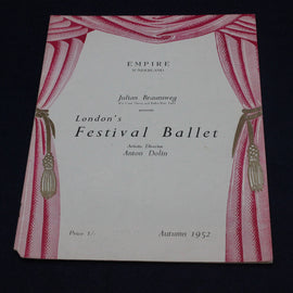 Vintage program for London's Festival Ballet with red curtain design on a black background