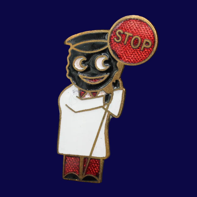 Pin featuring a Golly character holding a 'STOP' sign on a dark blue background
