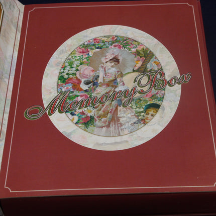 Decorative memory box with a vintage-style illustration on a red background