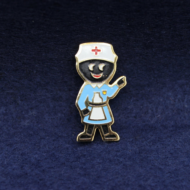 A colourful 1990s Robertson’s Golly Nurse badge featuring classic medical styling, prized by collectors of late‑era Golly designs.