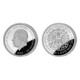 Two sides of a silver crown coin commemorating King Charles III's coronation on a white background.