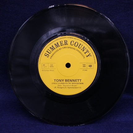 Vinyl record with yellow label featuring 'Summer County' and 'Tony Bennett' on a blue background