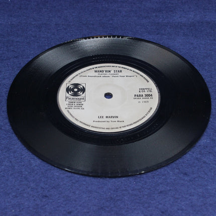 Vinyl record with label on a blue background