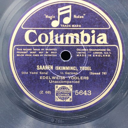 Columbia record label with text and music notes on a purple background