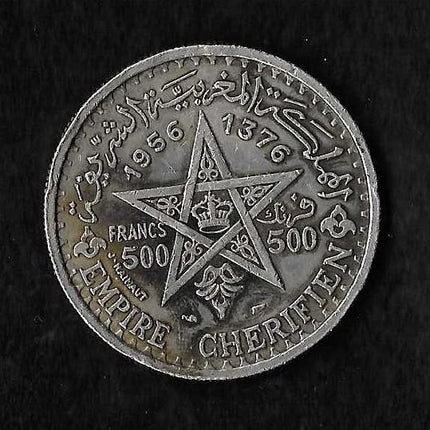 A circular silver-toned French Empire Cheriffen 500 Francs coin featuring a central five-pointed star with a crown, surrounded by Arabic and French text, displayed on a black textured background.