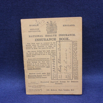 Vintage National Health Insurance book on a blue background
