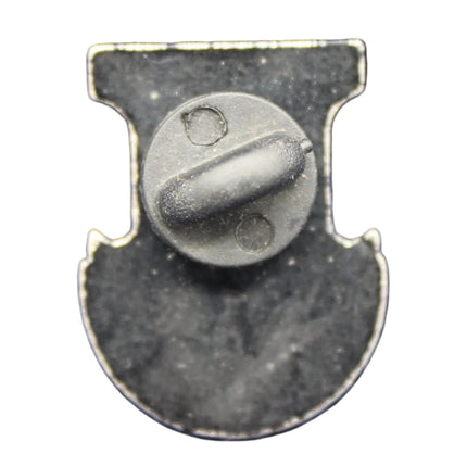Metallic badge or emblem on a textured blue background
