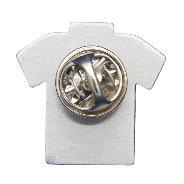 White shirt-shaped pin with a circular design on a blue background