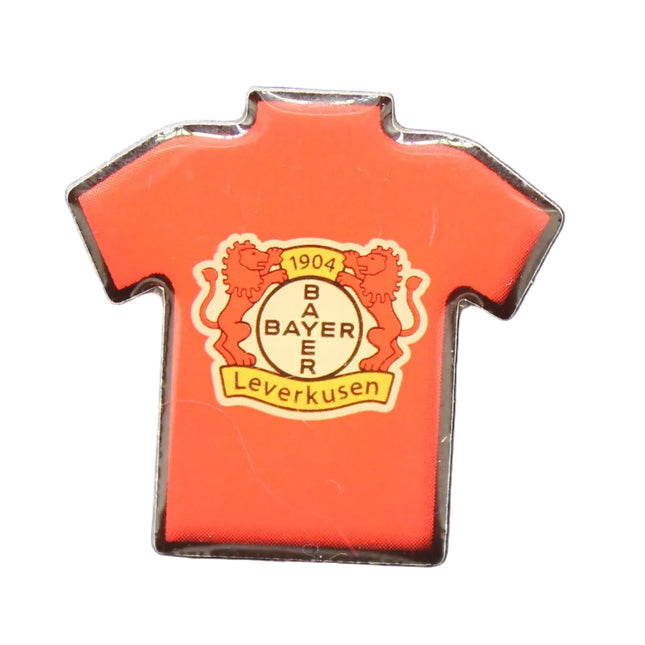 Red shirt-shaped pin with a logo on a blue textured background