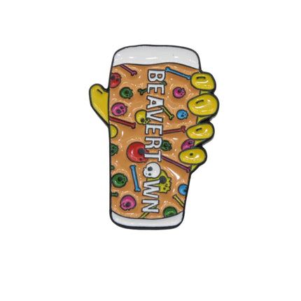 A novelty enamel pin shaped like a hand holding a beer glass, featuring a brown beer pattern with colorful candy graphics and the text 'BEAVERTOWN' on a plain light gray background.