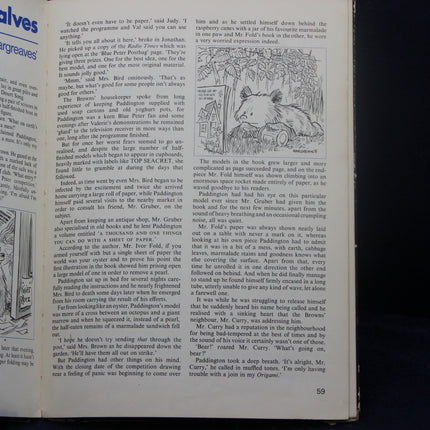 Open book with text and illustrations, including a bear and a house.
