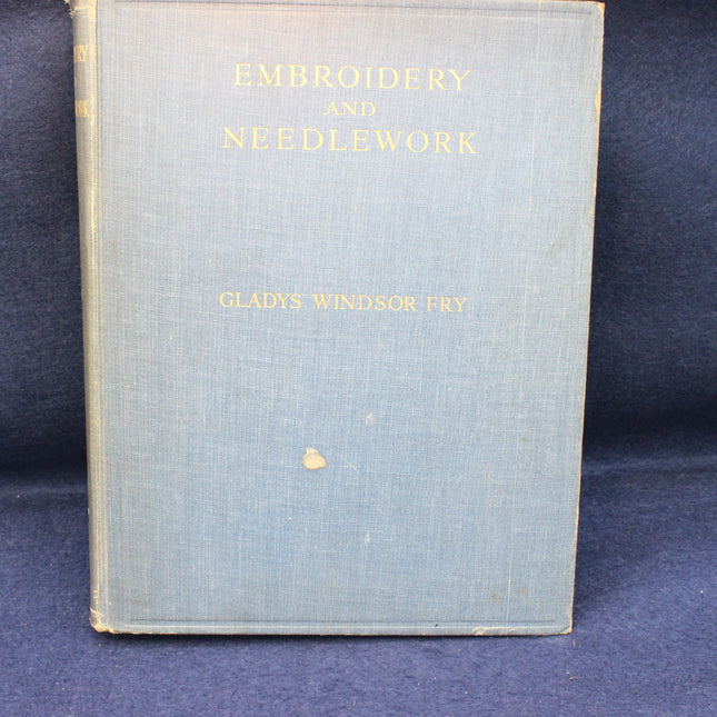 Book titled 'Embroidery and Needlework' by Gladys Windsor Fry on a blue background