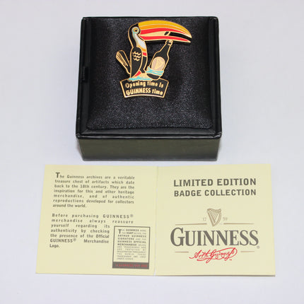 Guinness badge with toucan design in a black box with a yellow card