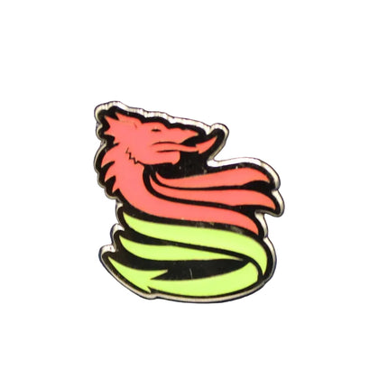 Colorful dragon-shaped pin on a textured blue background