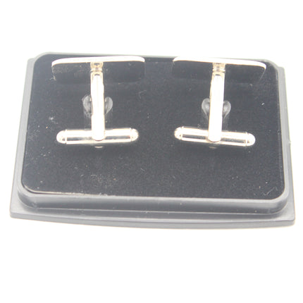 A pair of silver-toned T-bar cufflinks displayed on a black presentation box against a white background.