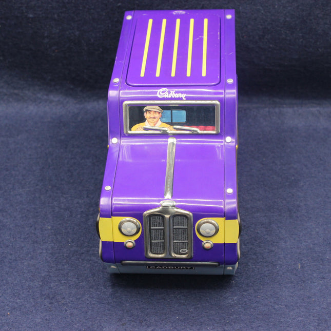 Model of a purple Cadbury Land Rover on a dark blue background