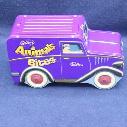 Purple truck-shaped container with 'Cadbury Animals Bites' text on a blue background