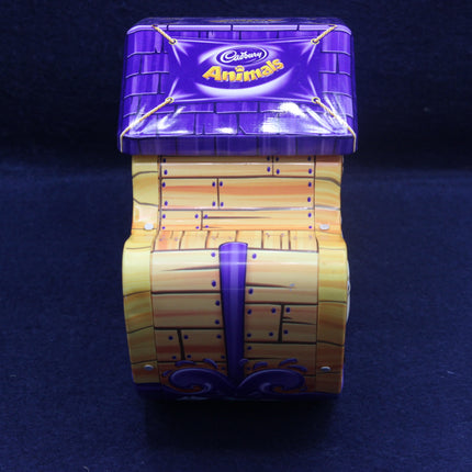 Cadbury Animals chocolate box with purple and yellow design on a dark background