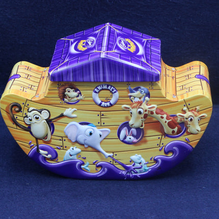 Noah's Ark toy with cartoon animals on a dark blue background