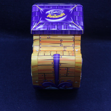 Stack of Cadbury Animals chocolate bars with purple and yellow packaging on a dark background