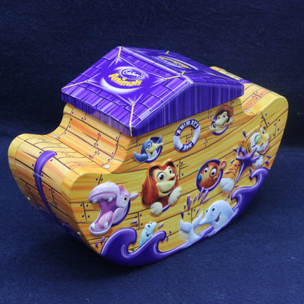 Cadbury Dairy Milk chocolate box with cartoon characters on a blue background