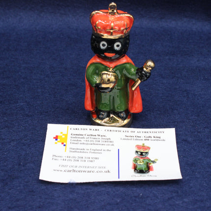 Carleton Ware Golliwog figurine with a certificate of authenticity on a blue background