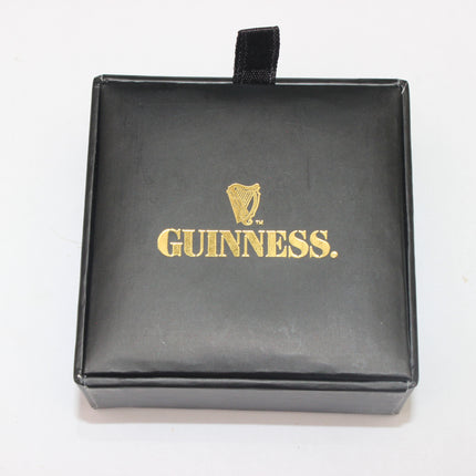 Black jewelry box with gold 'Guinness' logo on a white background
