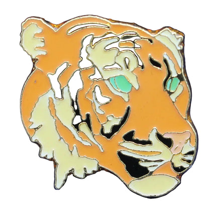 Tiger head pin on a blue textured background