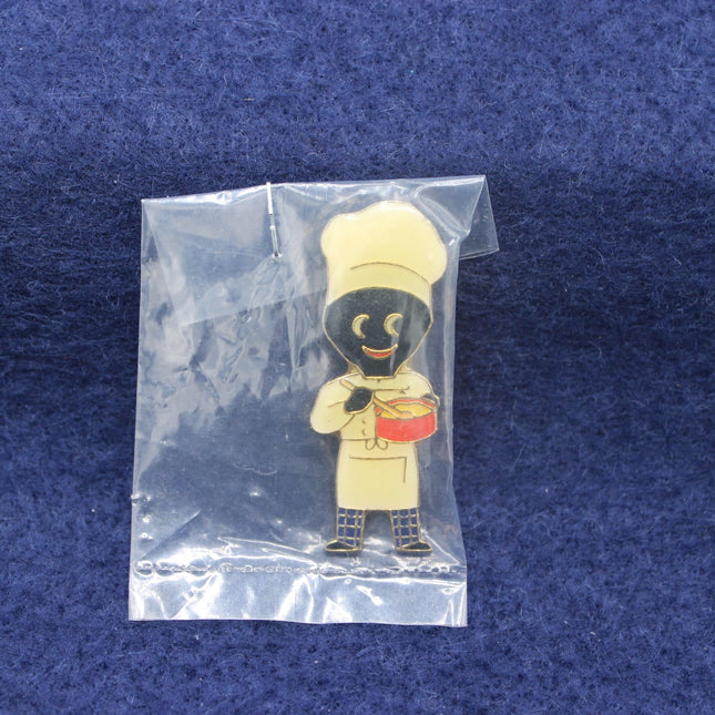 Factory sealed cream uniform Golly badge