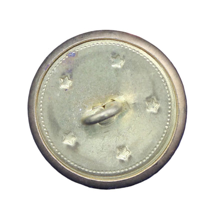 Bronze button with star design on a blue fabric background