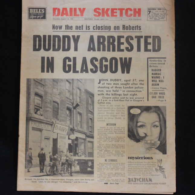 Vintage newspaper with headline 'Duddy Arrested in Glasgow' on a black background
