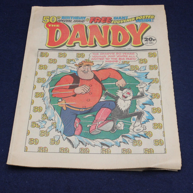 Vintage comic book 'The Dandy' with a character on the cover against a blue background