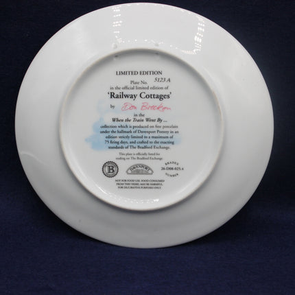 White plate with text and branding on a dark background