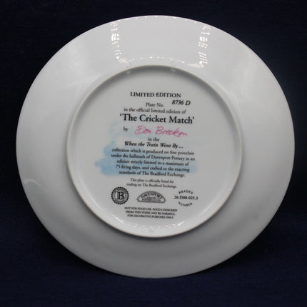 White ceramic plate with engraved text on a dark background