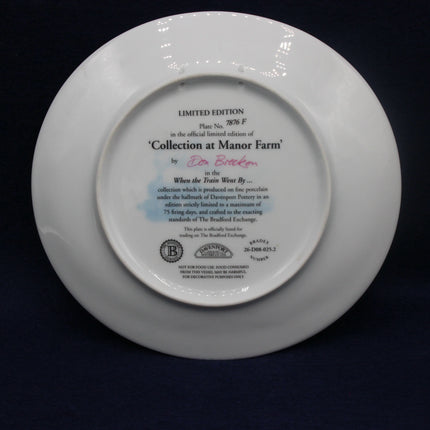 White plate with engraved text on a black background