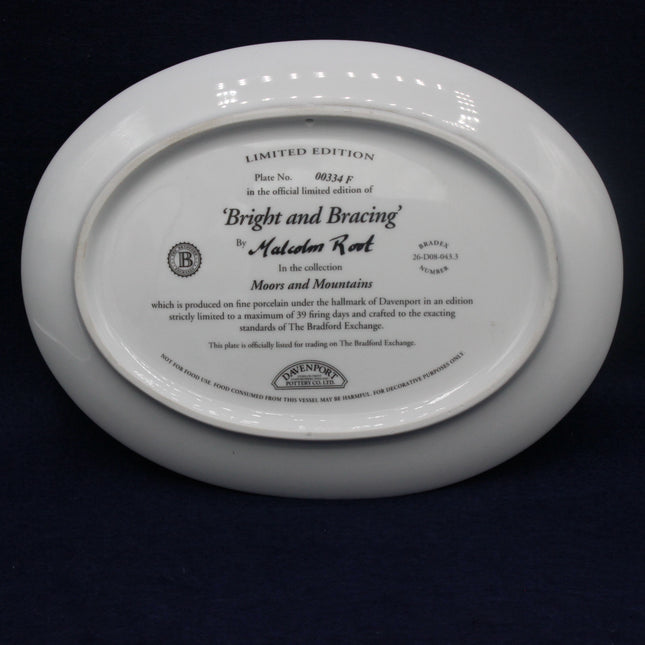 White plate with engraved text on a dark background