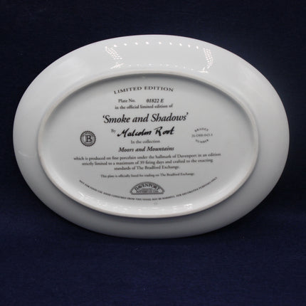 White ceramic plate with engraved text on a dark background
