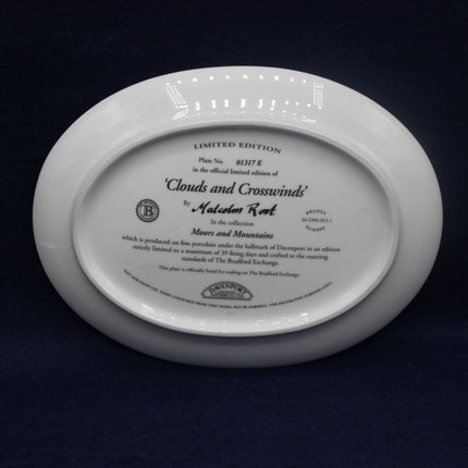 White decorative plate with engraved text on a dark background