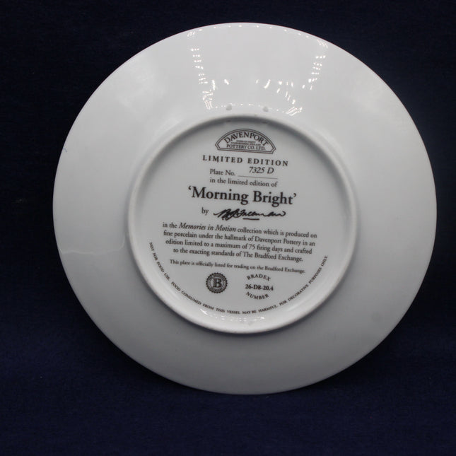 White plate with engraved text on a dark background