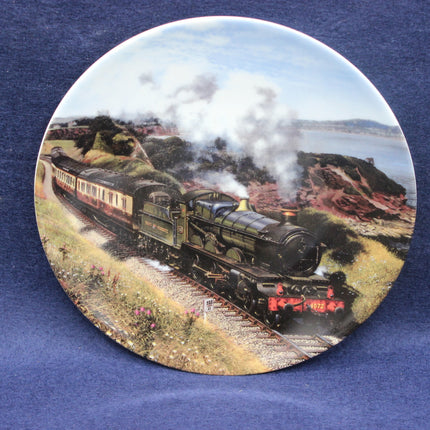 Decorative plate with a steam train design on a blue background