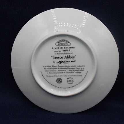 White plate with text and branding on a black background