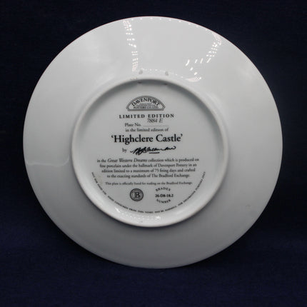 White plate with engraved text on a dark background