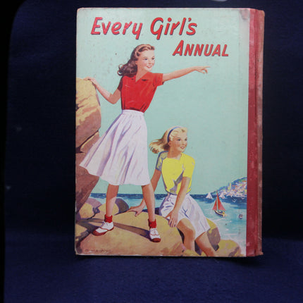 Book titled 'Every Girl's Annual' with illustration of two girls on a beach cover