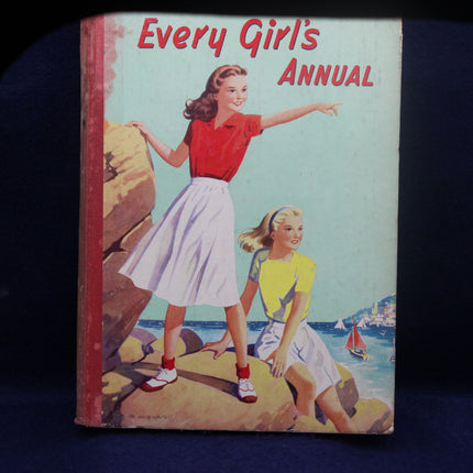 Vintage book cover titled 'Every Girl's Annual' with two girls on a beach.