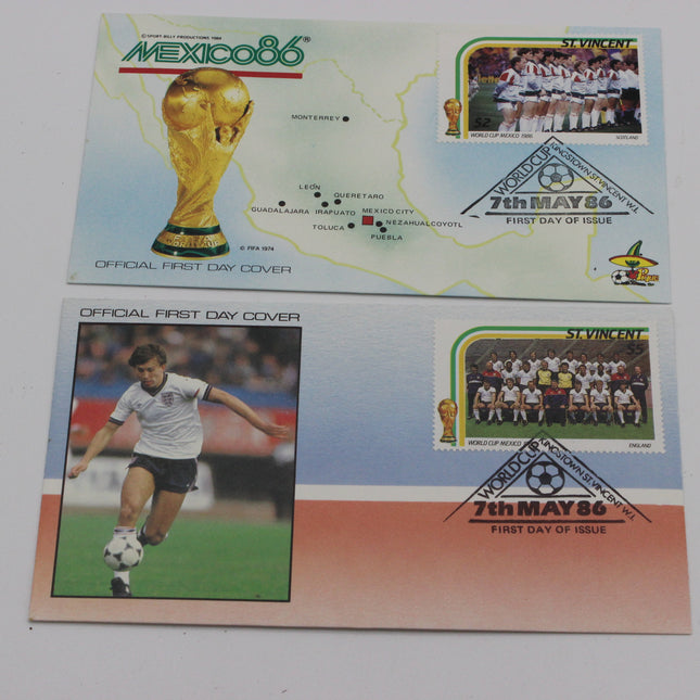 Two official first-day cover postage stamps from Mexico 1986 football tournament, one featuring the World Cup trophy and map, and the other featuring a soccer player and team photo.