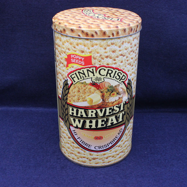 Finn Crisp Harvest Wheat crispbread canister on a blue background