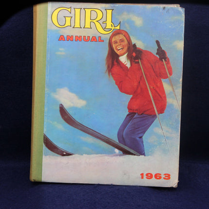 1963 Girl Annual book cover with a girl skiing against a blue sky.