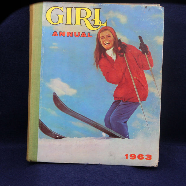 1963 Girl Annual book cover with a girl skiing against a blue sky.